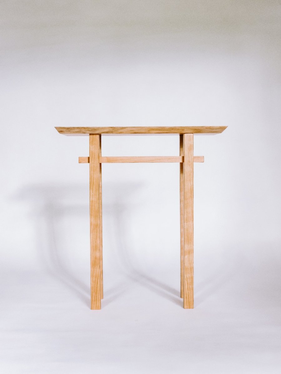 small narrow end table in solid cherry with a live edge table top