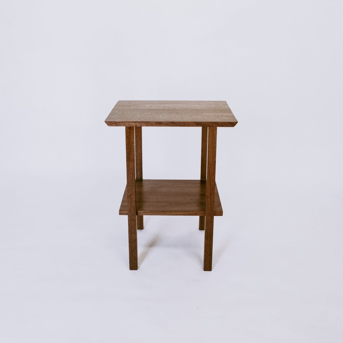 Modern wood table in solid walnut by Mokuzai Furniture