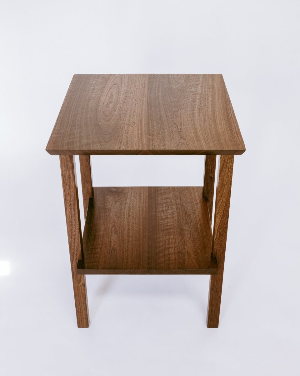 A solid walnut side table or nightstand