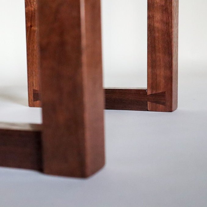 The dovetail feet details for a custom entry table by Mokuzai Furniture.