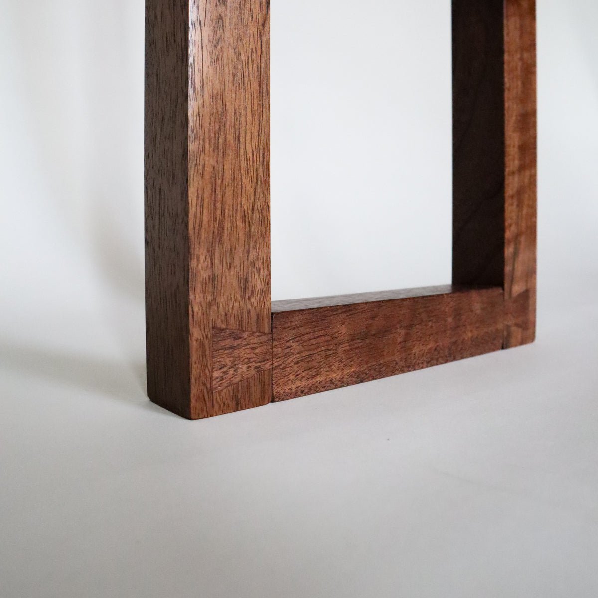 This are special dovetail feet details on a narrow console table created by Mokuzai Furniture.