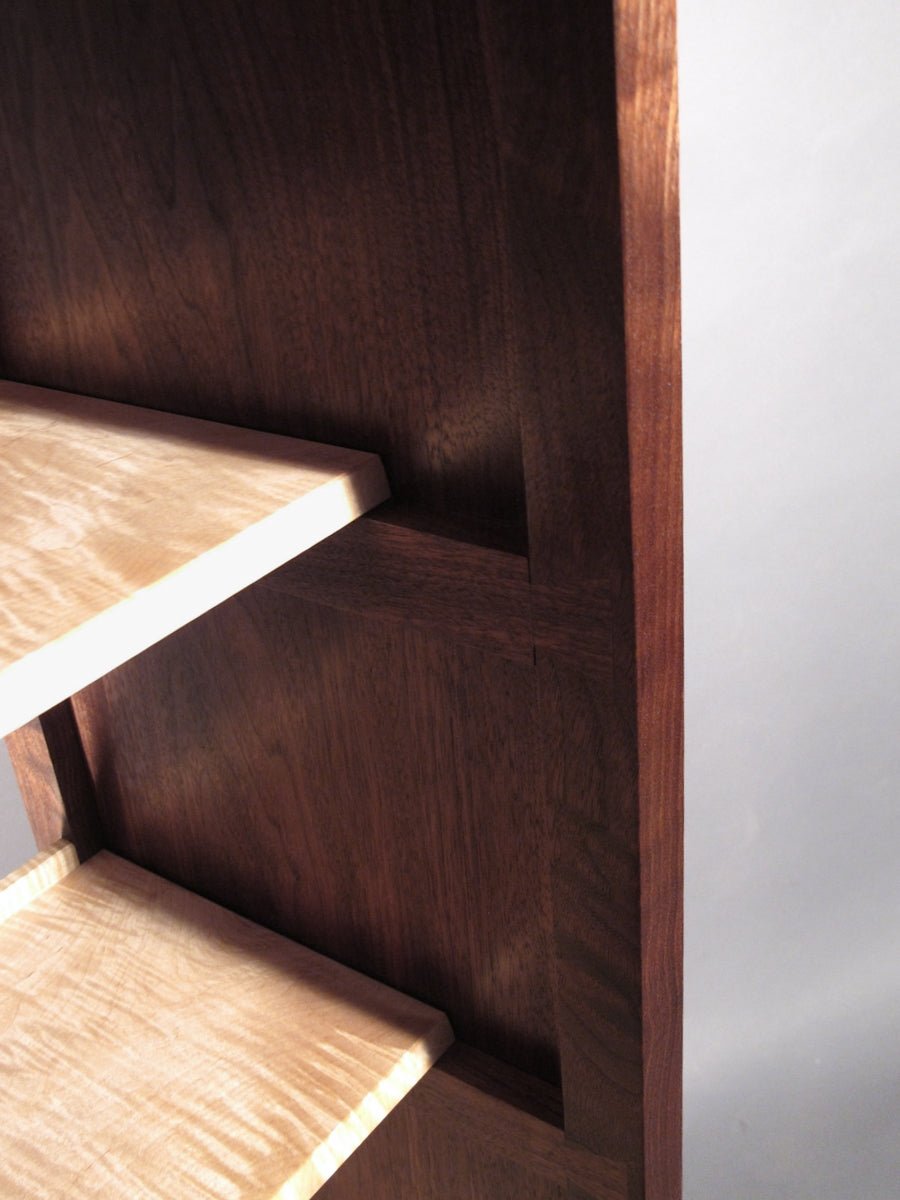 dovetail joinery details on a column of shelves that is a modern open back bookcase created by Mokuzai Furniture