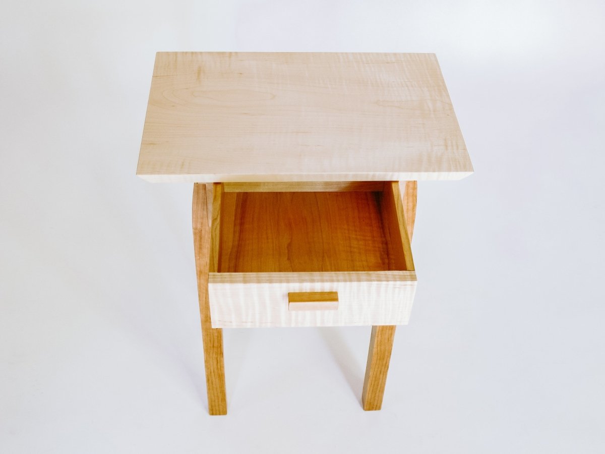 Viewed from above, our small end table with drawer features solid wood drawer interiors that are as beautiful inside as this modern wood table is on the outside.  The perfect little table beside your favorite chair.