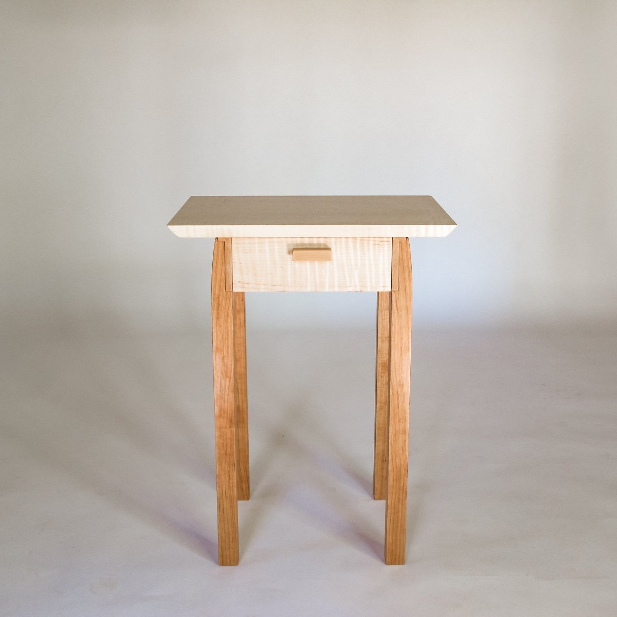 a small wooden table with drawer for your living room furniture or as a nightstand in a small bedroom design
