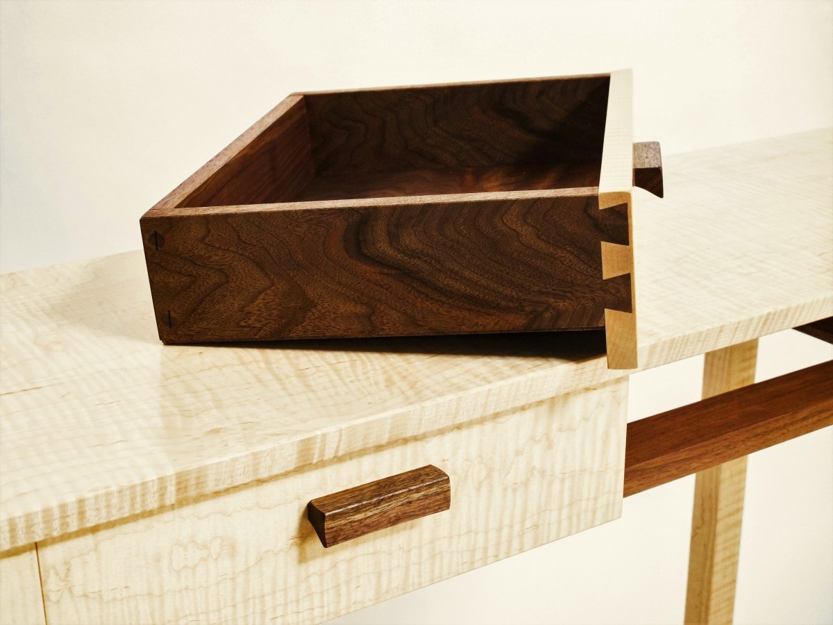 the narrow drawers of this custom console table are beautiful inside and out