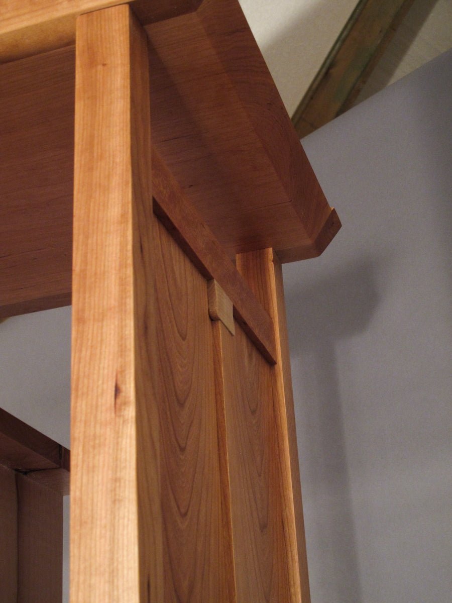 fine furniture details on a tall narrow storage cabinet by Mokuzai Furniture