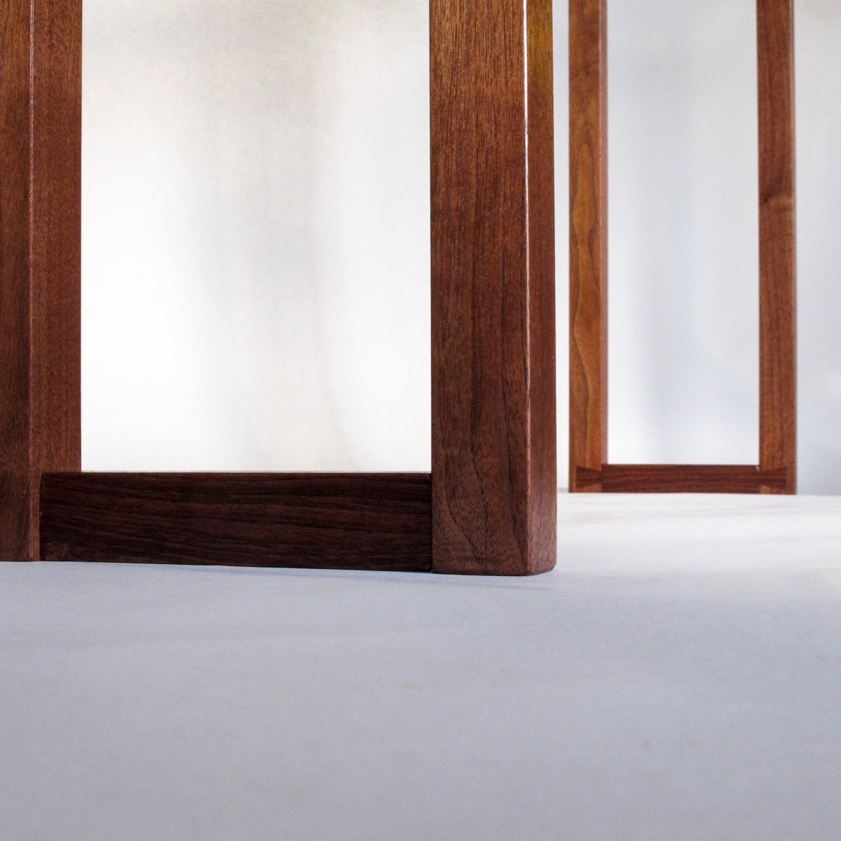 Hand-cut dovetail feet details on an entryway console table by Mokuzai Furniture.