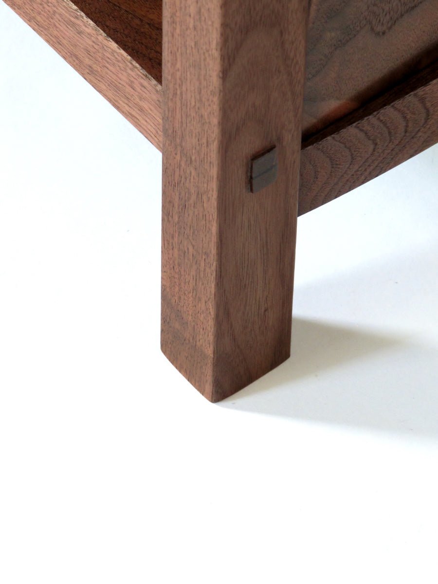 joinery details on a tall curio tower in walnut by Mokuzai Furniture