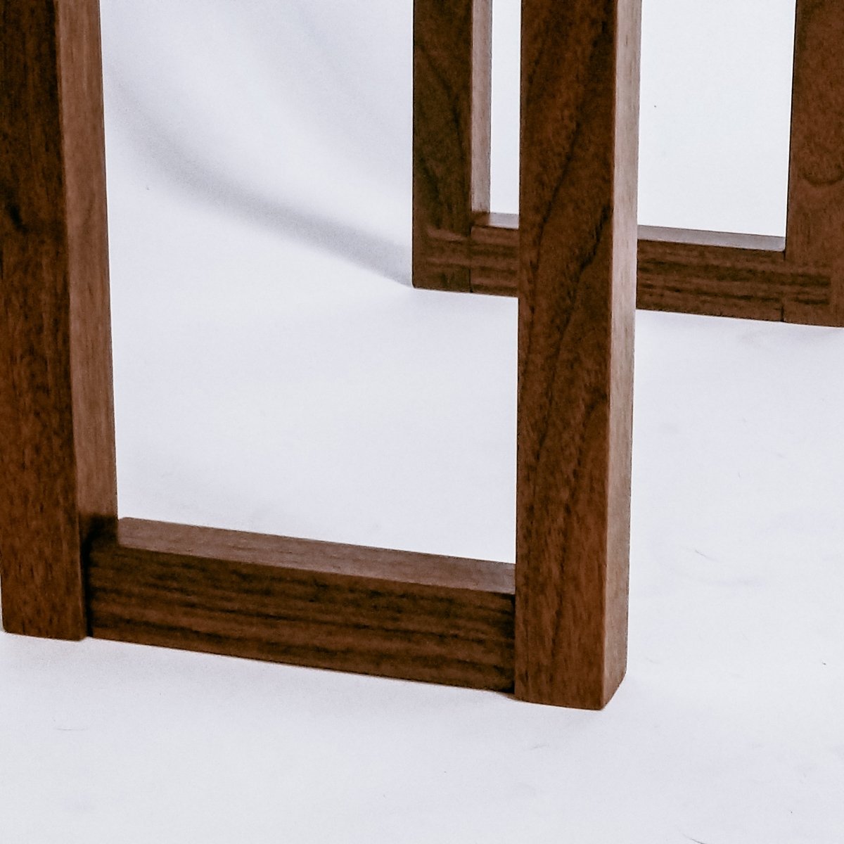 Our Live Edge Side Table features fine craftsmanship details like these dovetail feet
