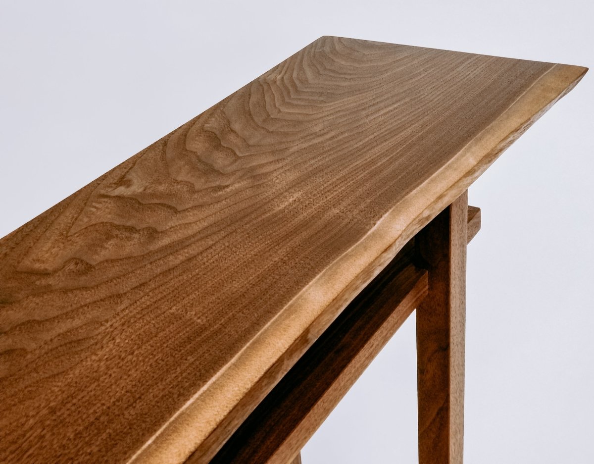 A live edge table in solid walnut- narrow side table or small console