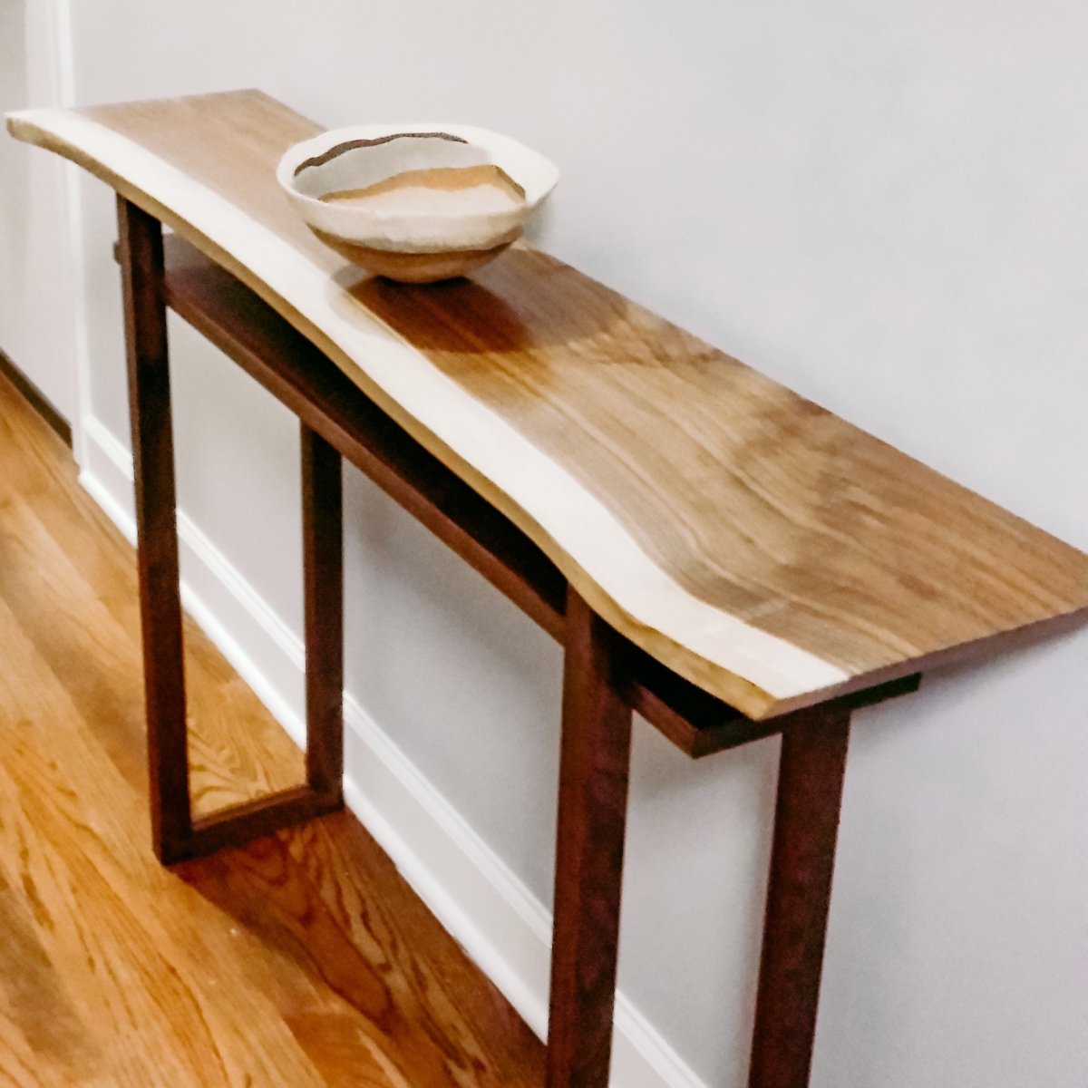 A live edge walnut hall console table by Mokuzai Furniture