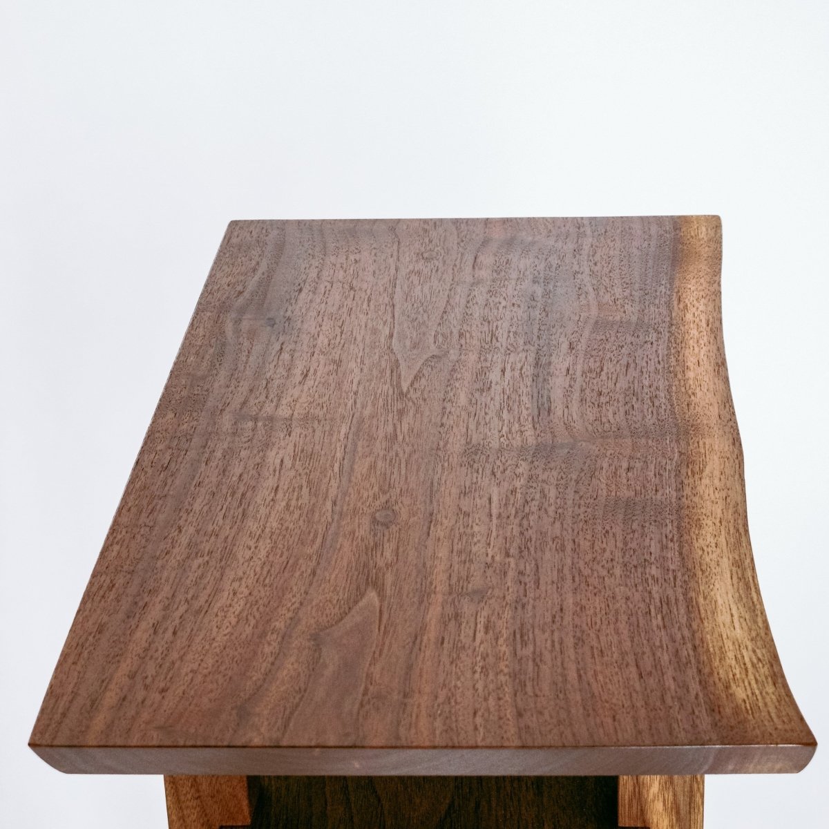 A live edge walnut table top adds an extra touch of Mother Nature's beauty to your intentional home decor.  This small end table has a live edge walnut table top- by Mokuzai Furniture