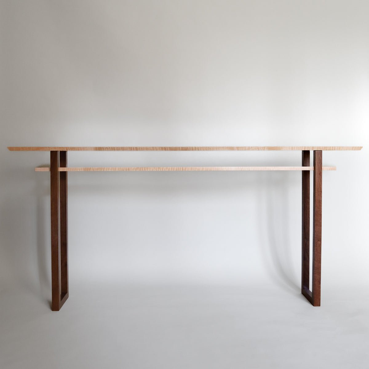 A modern wood long narrow console table handcrafted by Mokuzai Furniture.