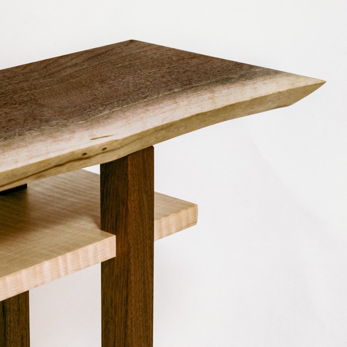 A minimalist live edge end table with tiger maple shelf by Mokuzai Furniture