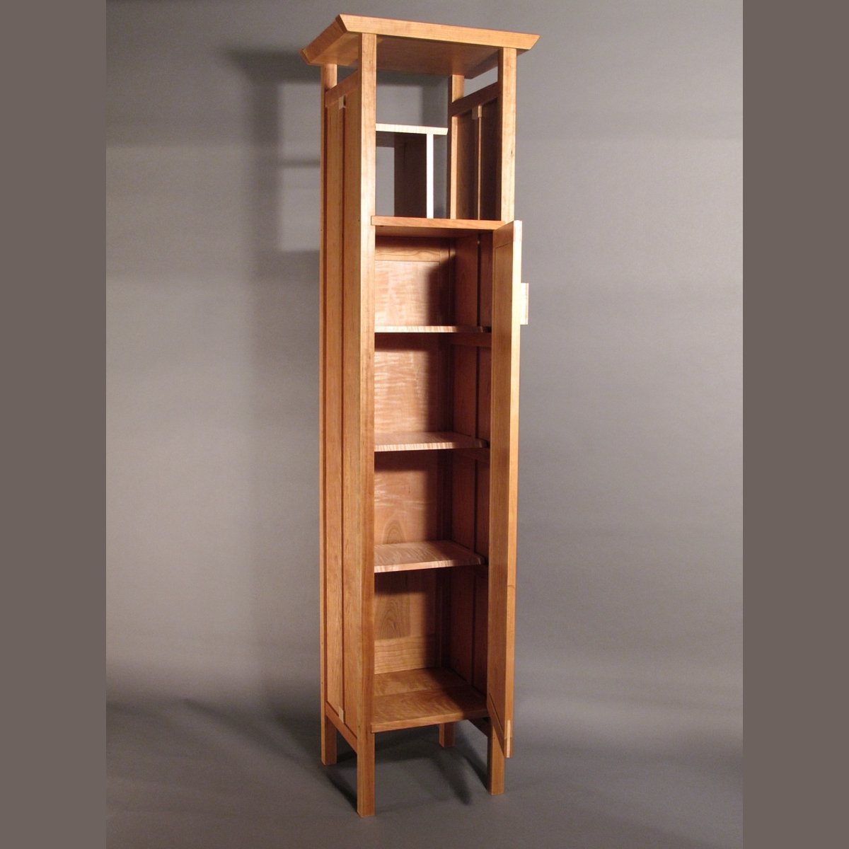 modern freestanding linen storage tower that is a narrow wood cabinet by Mokuzai Furniture