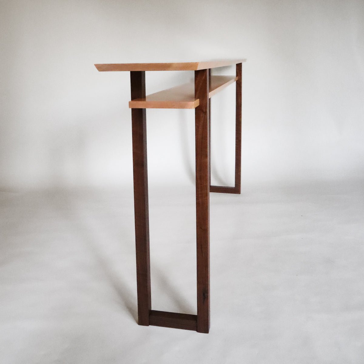 A long narrow console table for hallways by Mokuzai Furniture.