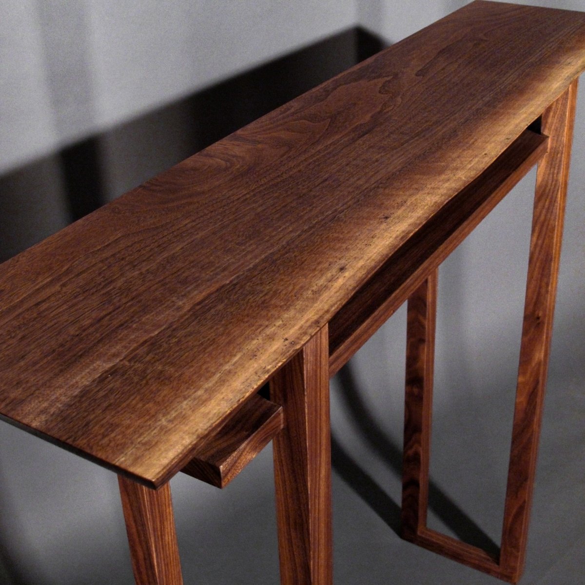 Add a natural edge table top to your walnut custom console table with MokuzaiFurniture