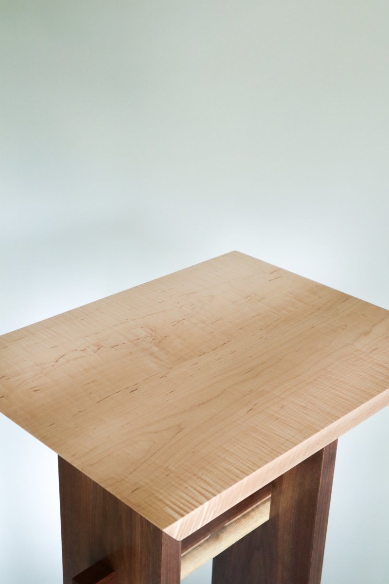 A narrow table, tall for a podium or modern lectern.  A minimalist furniture design by Mokuzai Furniture