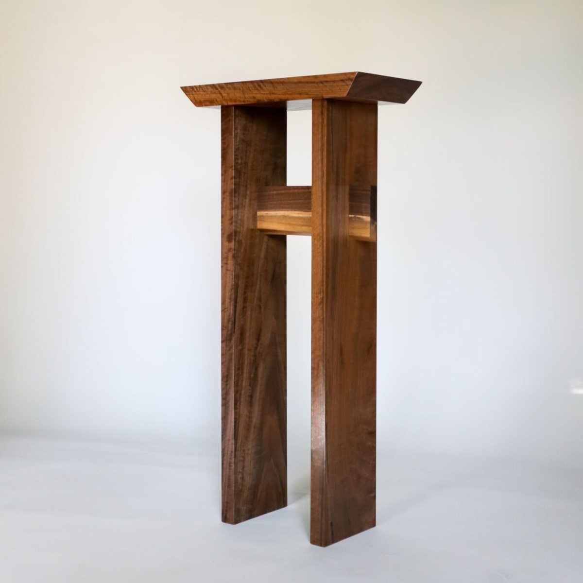 a tall walnut table narrow for entryways by Mokuzai Furniture