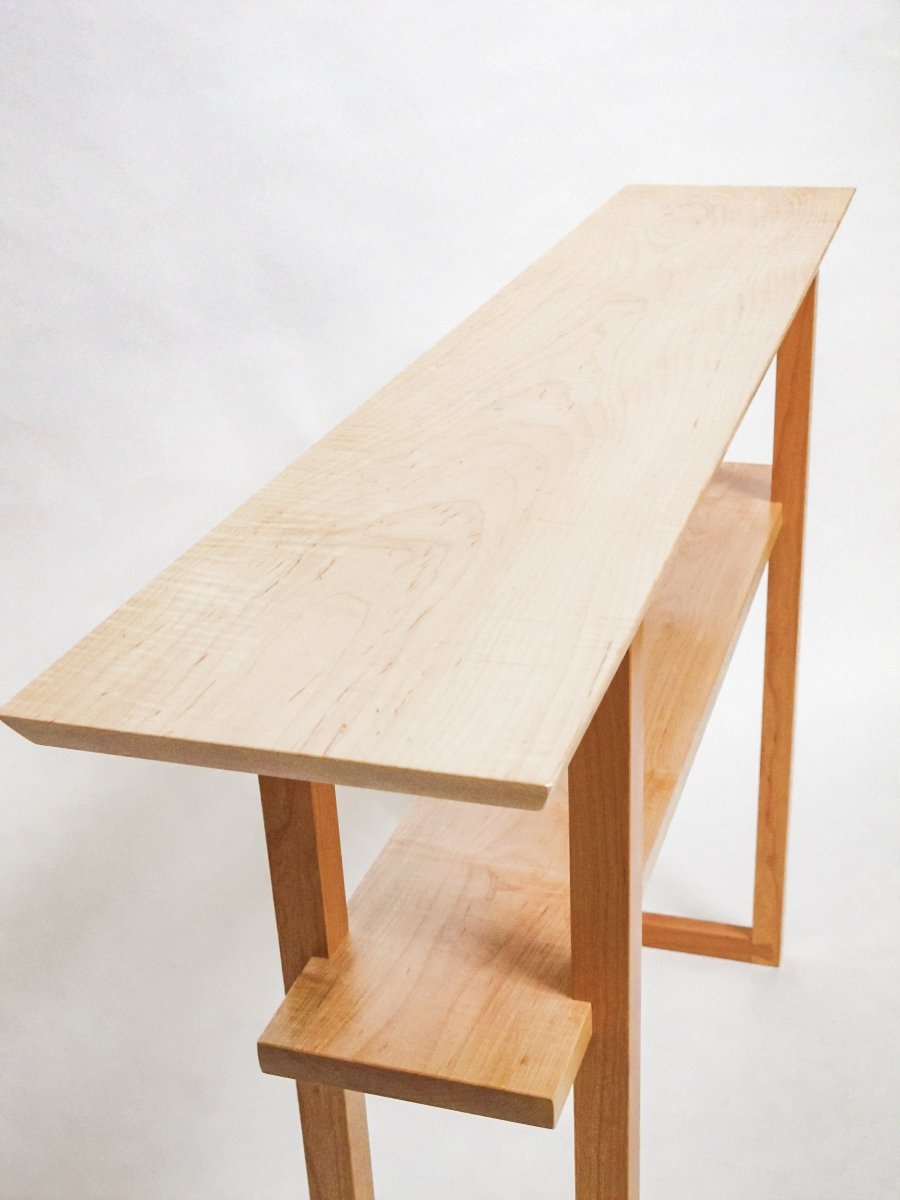 Tiger maple table top and shelf on this narrow sofa table with cherry table legs.  The shelf is good for display and the narrow table design works well for small space decorating.  modern sofa table by Mokuzai Furniture