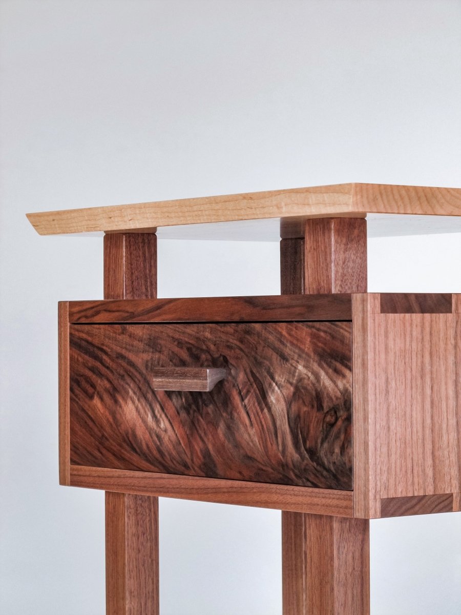 A handmade wooden nightstand created from walnut and tiger maple - small end table with drawer