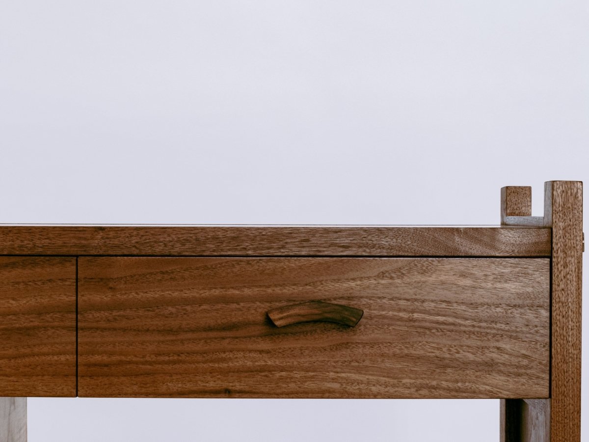 hand-shaped drawer pulls on our walnut sofa cabinet