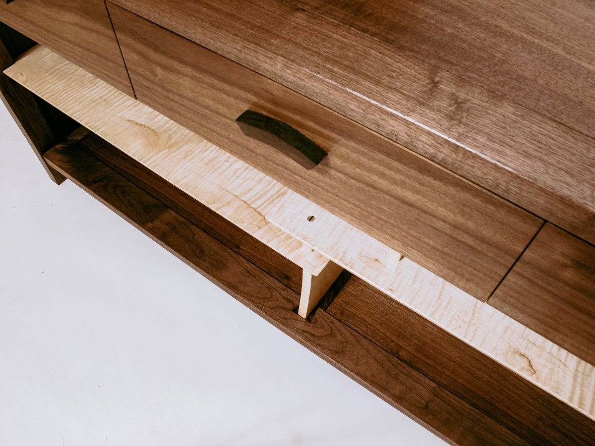 walnut and tiger maple solid wood cabinet with contrasting wood tones