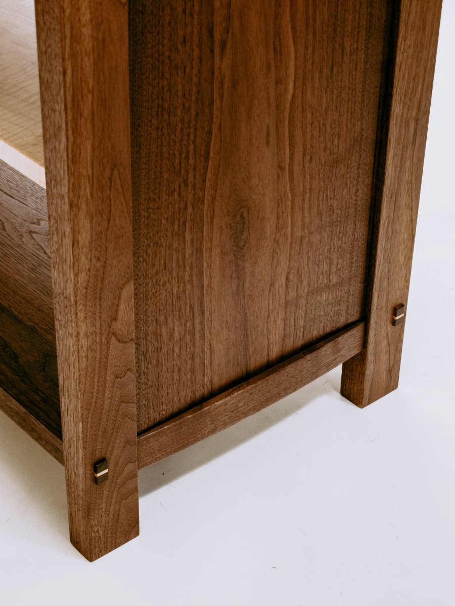 elegant curves balance the handsome lines of our walnut cabinet with drawers
