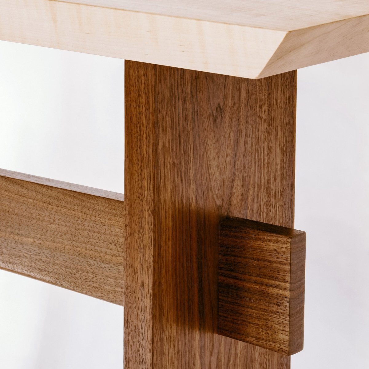 tiger maple table top and solid walnut table base on this minimalist hallway table design by Mokuzai Furniture