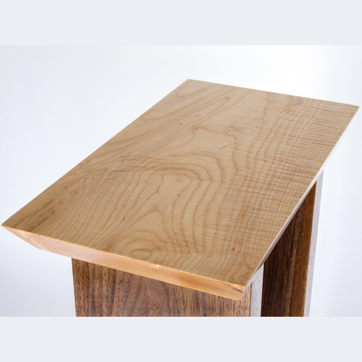 a tiger maple table top on a small entry table by Mokuzai Furniture