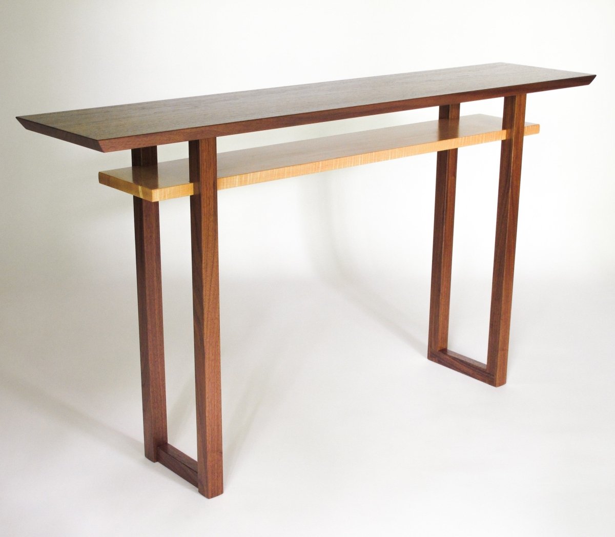 A walnut console table narrow for hallway decorating by Mokuzai Furniture.