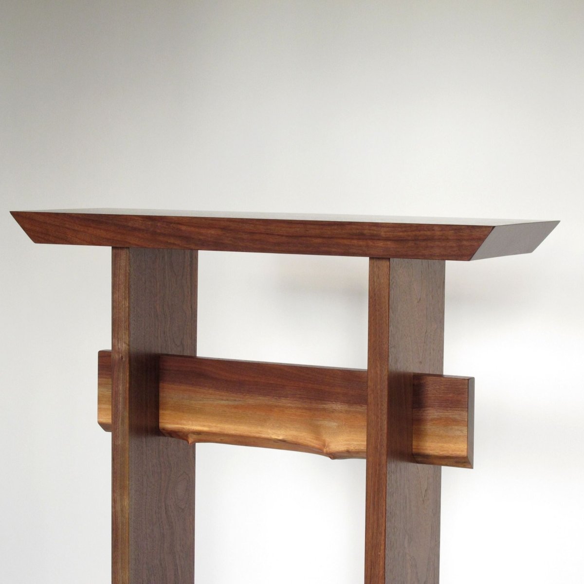 a walnut hall table with live edge table stretcher by Mokuzai Furniture